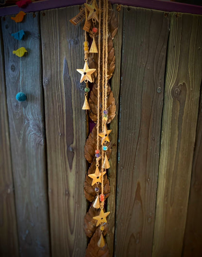 String of 5 stars with bells